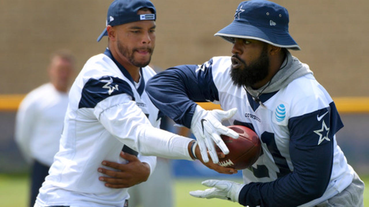 Cowboys' Elliott smiles for fans, shuns media as issues loom